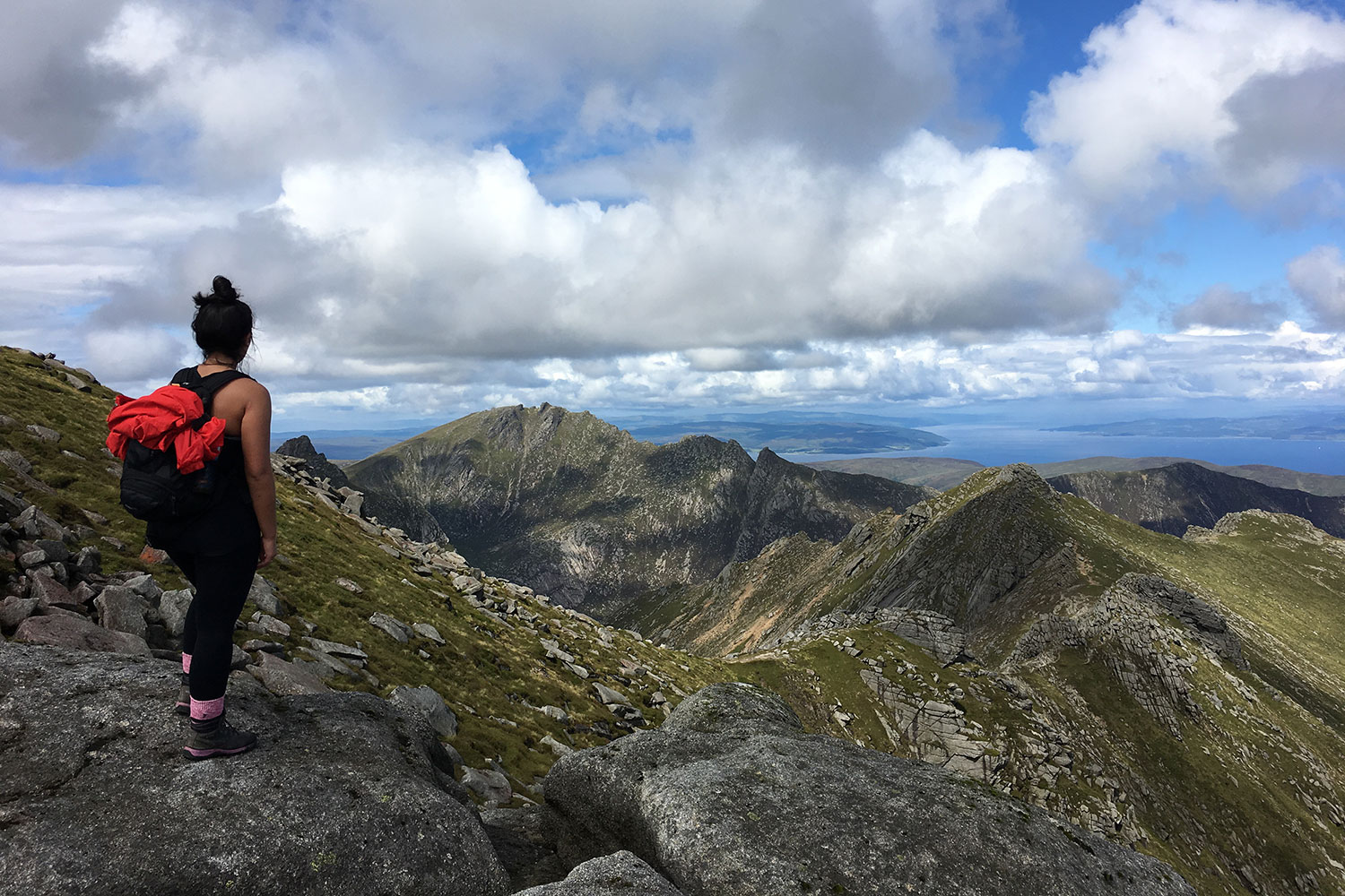 Walker admiring the mountain scenery on Arran
